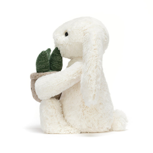 Zachte Jellycat konijn knuffel met plant accessoire